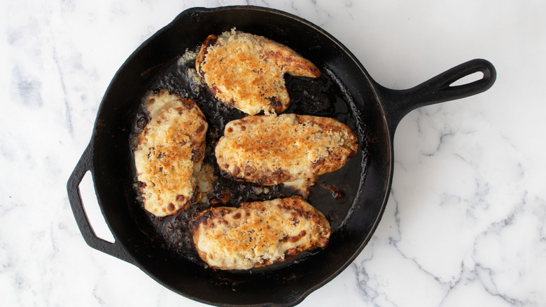 Parmesan crusted chicken in skillet