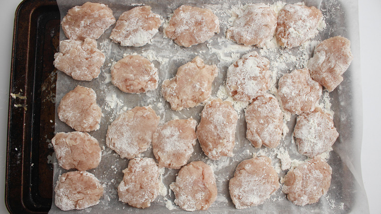 Photo of chicken nuggets (raw) on tray