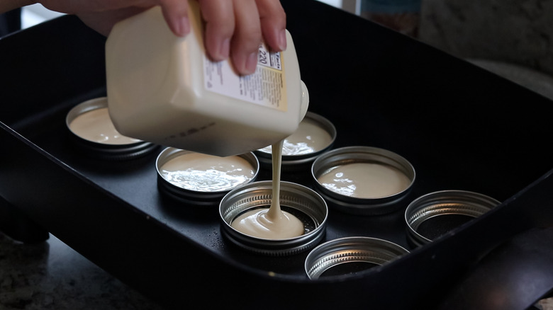 Pouring batter into rings on griddle