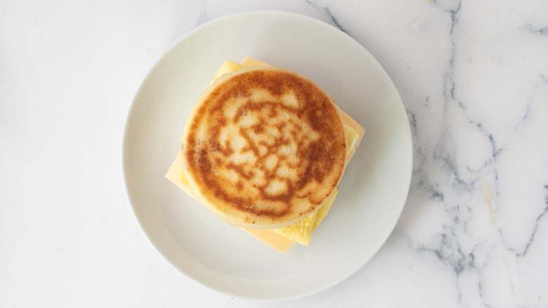 Breakfast sandwich made with thick, round pancake