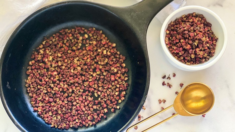 Peppercorns in a skillet for toasting