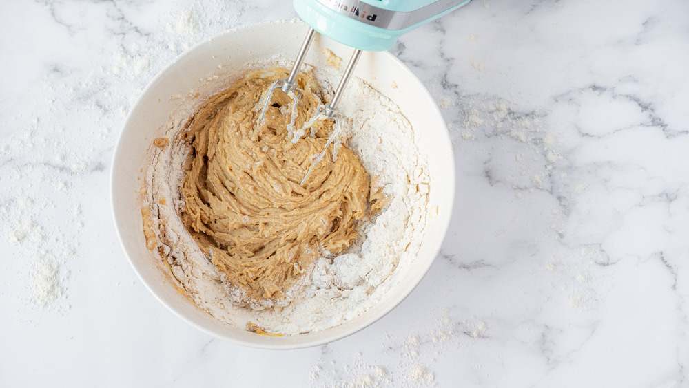 adding flour to cookie dough for copycat oatmeal cream pies