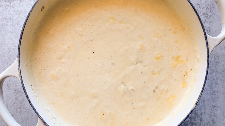 Potatoes added to simmering soup