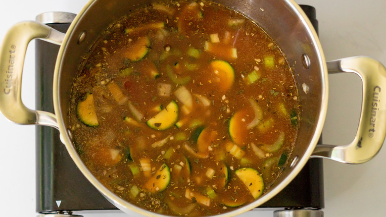 vegetables and red wine in soup pot