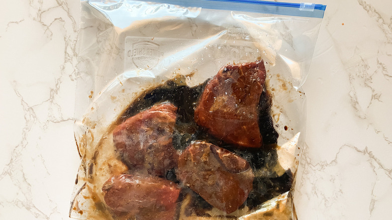 Steaks marinating in zip-loc bag