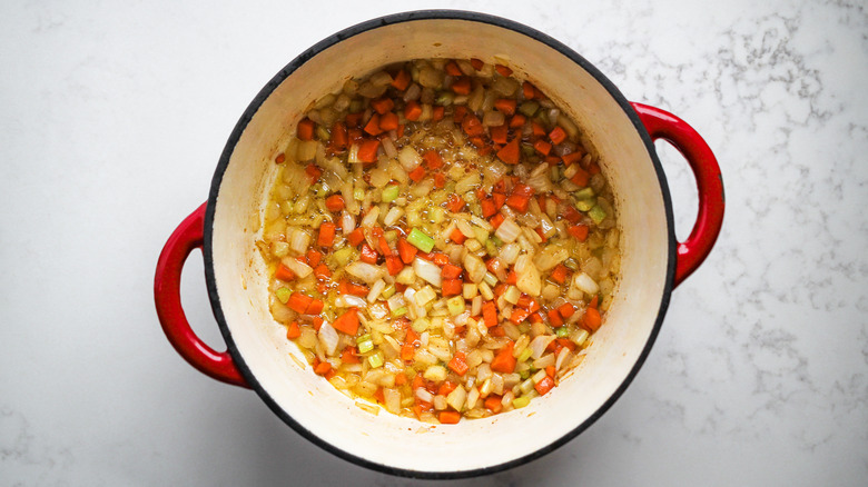 cooking diced vegetables in pot