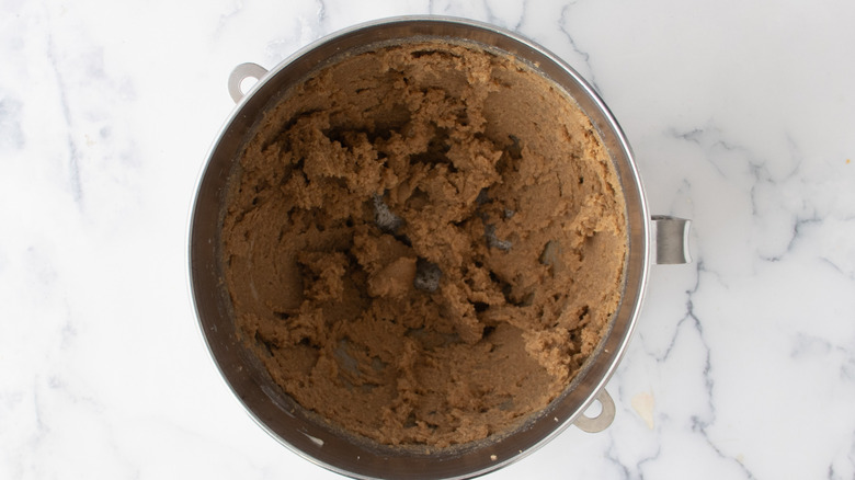 Brown sugar and butter mixture in a metal bowl