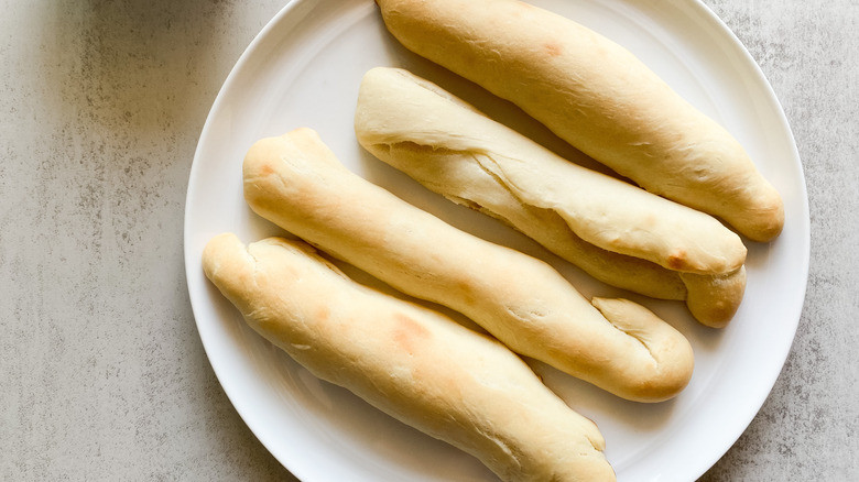 baked breadsticks on a plate