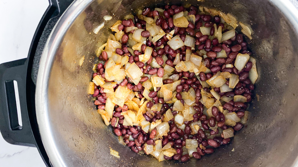 beans, onions and seasoning in Instant Pot for copycat Popeyes red beans and rice