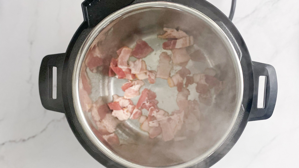 bacon cooking in Instant Pot for copycat Popeyes red beans and rice