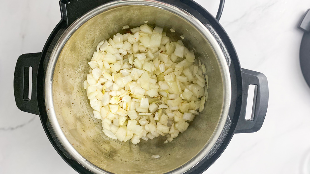 onion cooking in Instant Pot for copycat Popeyes red beans and rice