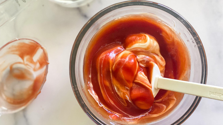 mixing Copycat Raising Cane's sauce ingredients in glass bowl 