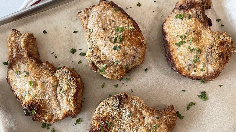 Copycat Shake 'n Bake pork chops on baking sheet 