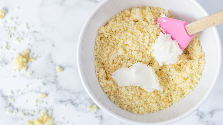 mixing cake crumbs and frosting for copycat Starbucks cake pops