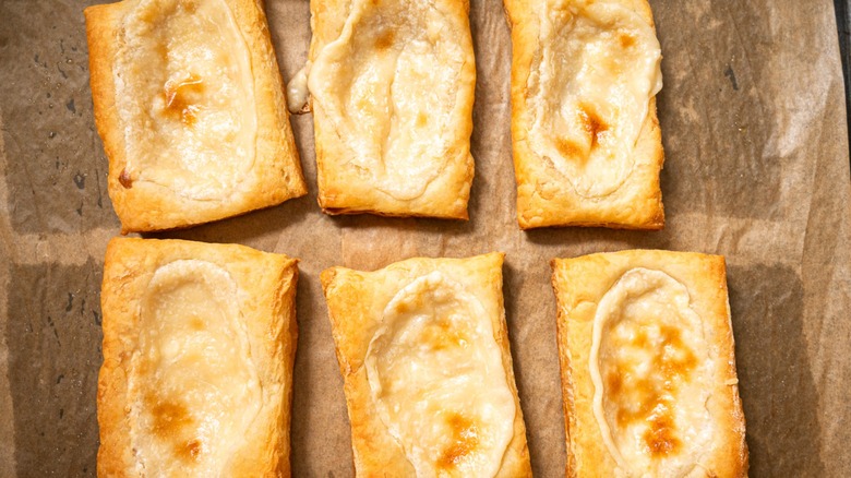 golden baked cream cheese danishes on baking tray