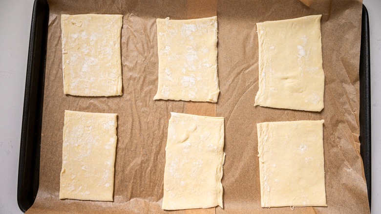 sliced pastry on baking sheet