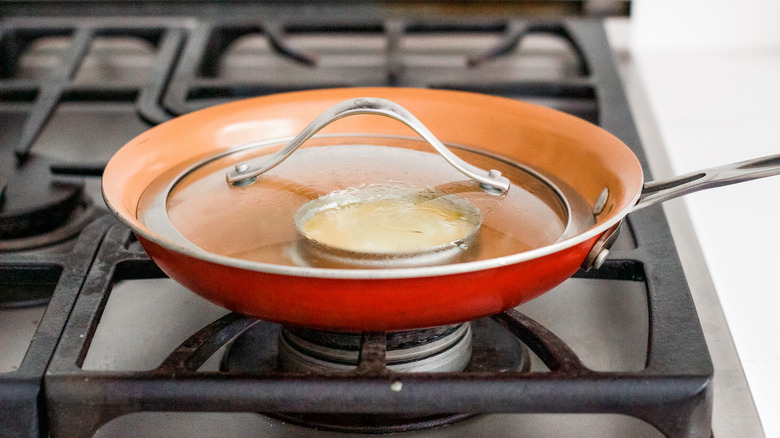 egg in covered pan