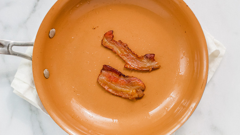 Bacon frying in pan