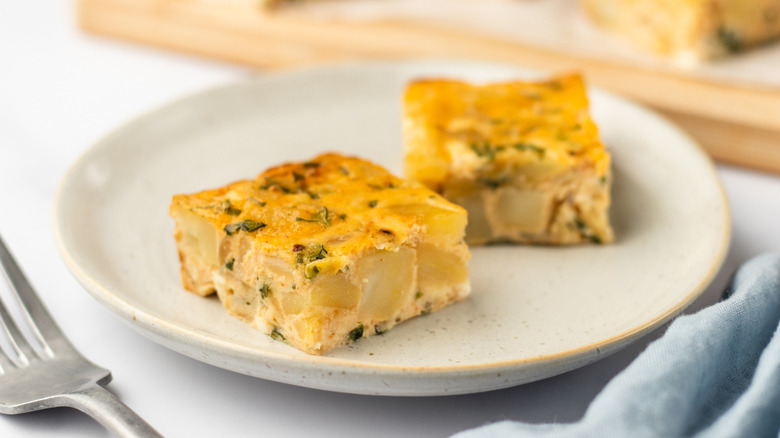 Two pieces of potato chive bake in plate