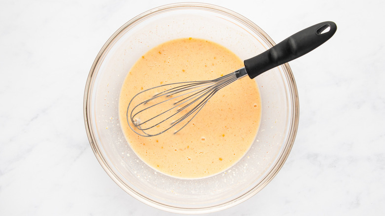 Egg and cottage cheese mixture whisked in mixing bowl