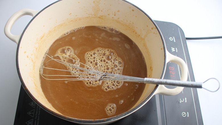 whisking ingredients in saucepan