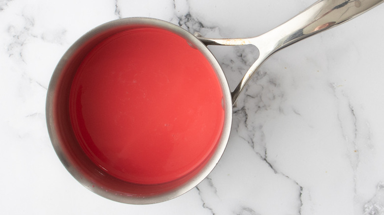 red milk in saucepan