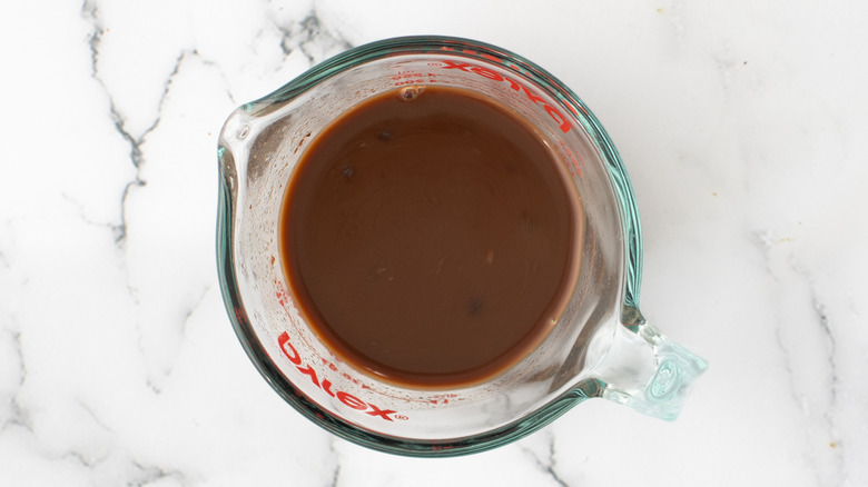 cocoa coffee in measuring cup