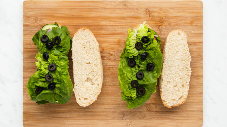 lettuce and olives on bread