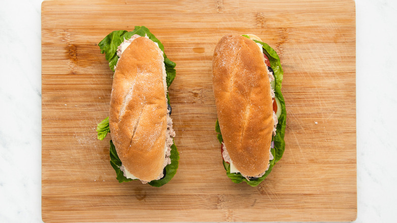 tuna sandwiches on wooden board