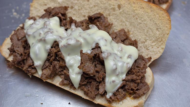 Sub roll with chopped steak and melted cheese