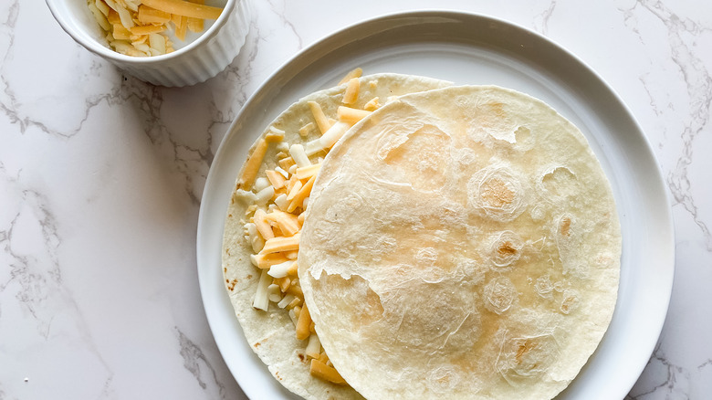 prepping quesadilla for cooking