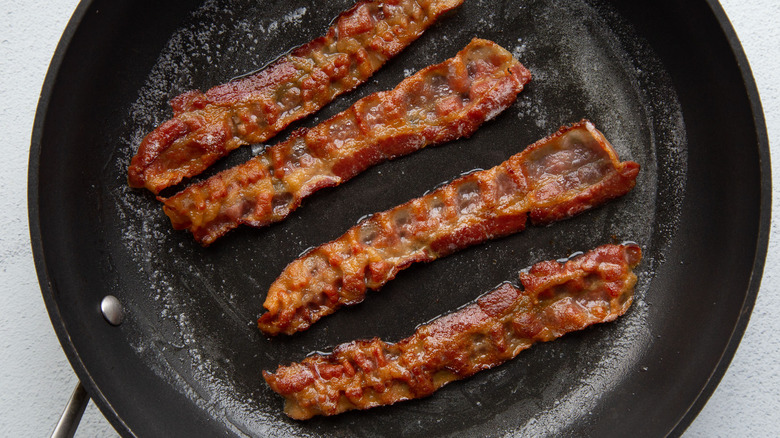 bacon cooking in skillet 