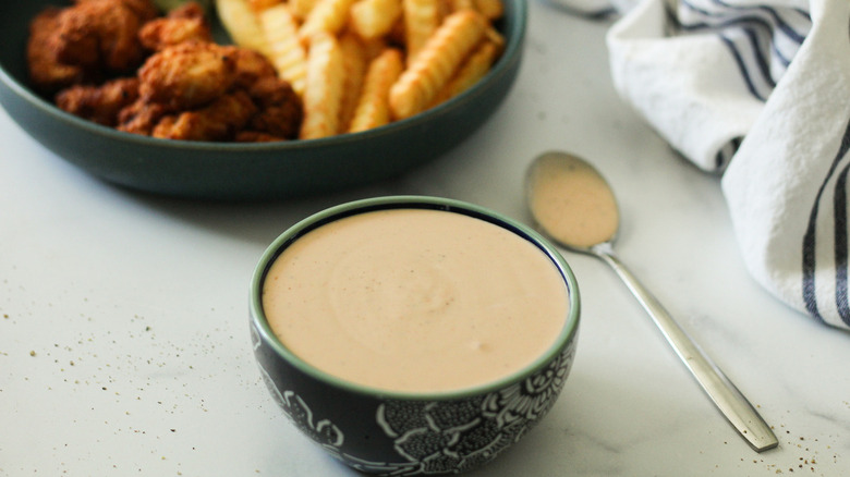 orange sauce in green bowl