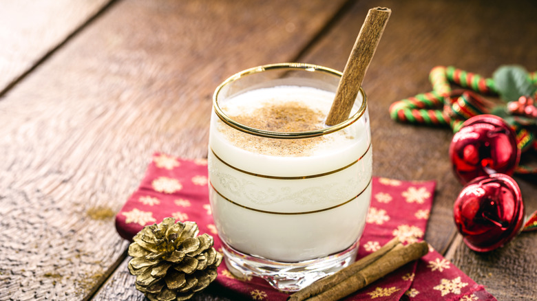 Glass of coquito with cinnamon stick