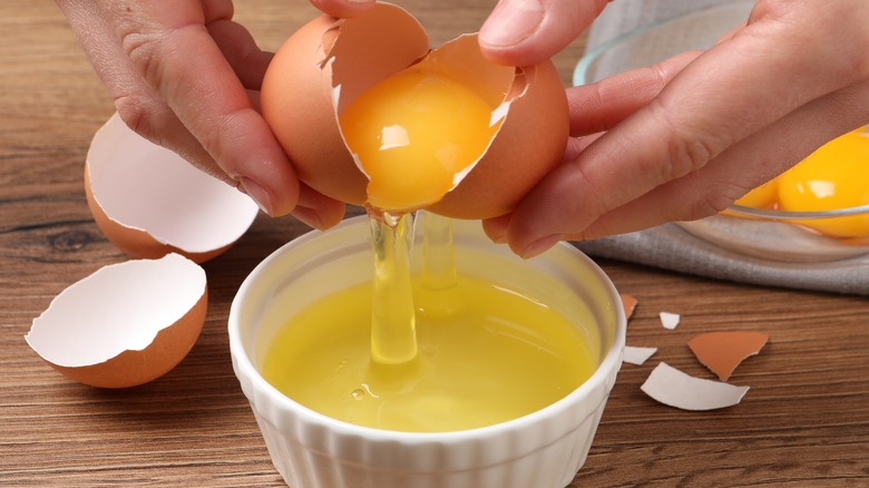 Person breaking an egg