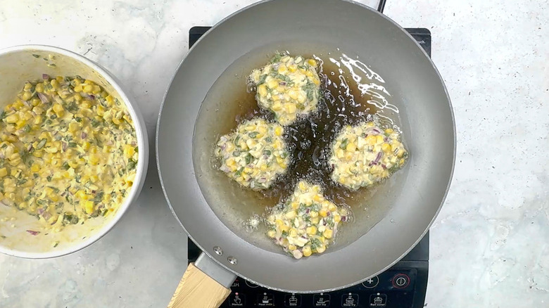 cooking corn and jalapeño fritters