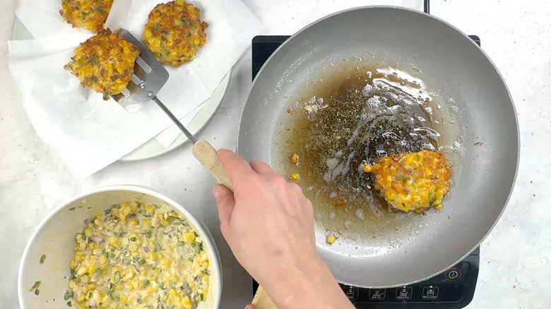 transferring fritter to a plate