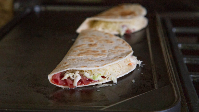 corned beef quesadillas on a griddle