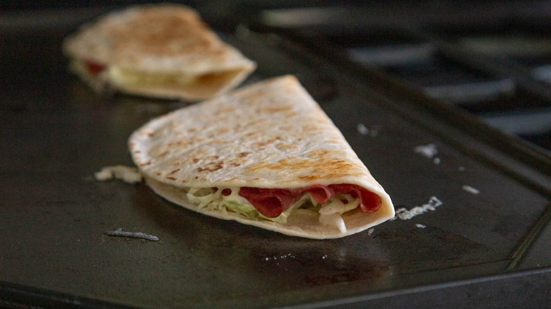 corned beef quesadillas on a griddle