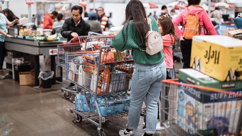 a crowd of Costco customers at checkout