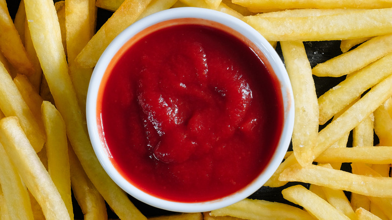 close-up of ketchup with fries