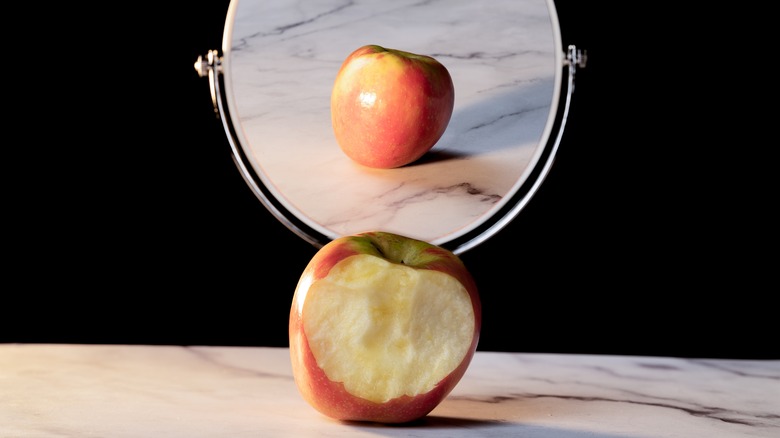 Half apple showing perfect reflection