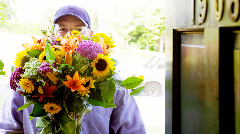 Flower delivery person with bouquet