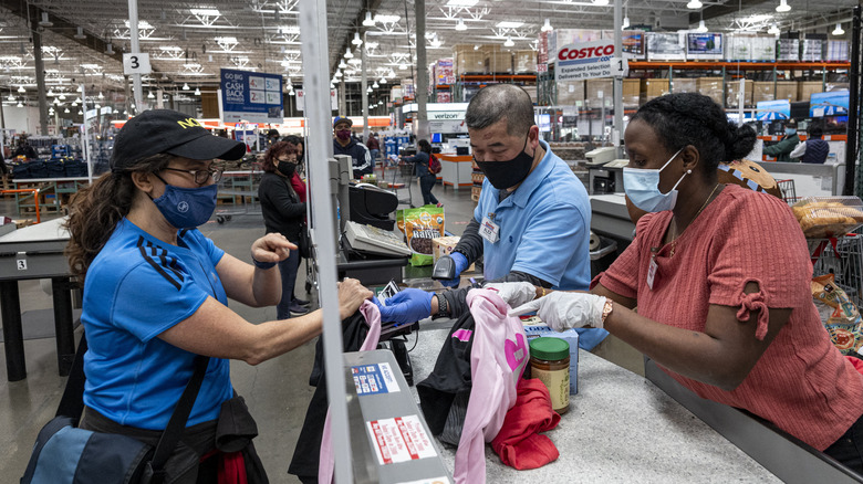 Masked Costco employees and customer