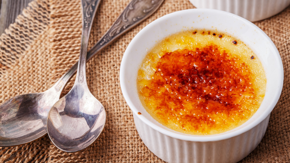 cup of creme brulee with spoons