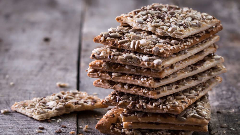 Stack of sesame chips on table