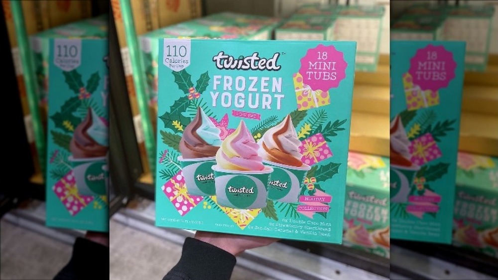 Hand holding box of frozen yogurt treats