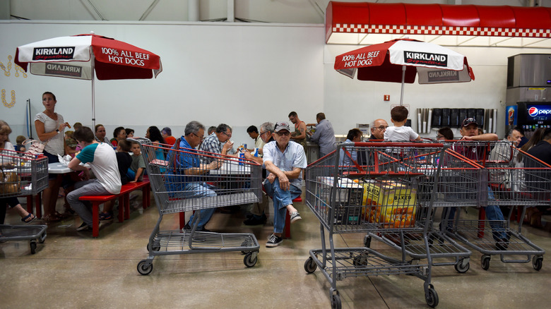 Customers sitting inside Costco food court