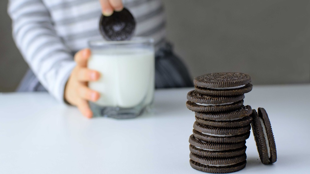 Dunking Oreo cookie in milk