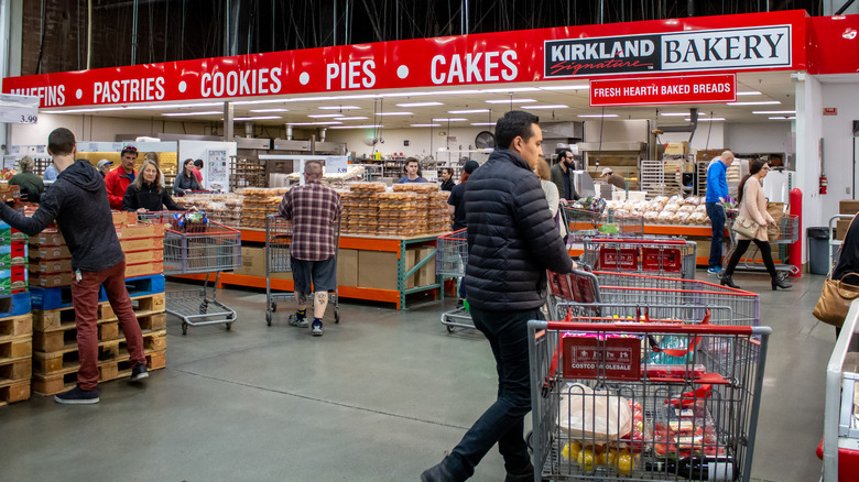 Costco customers exploring bakery section